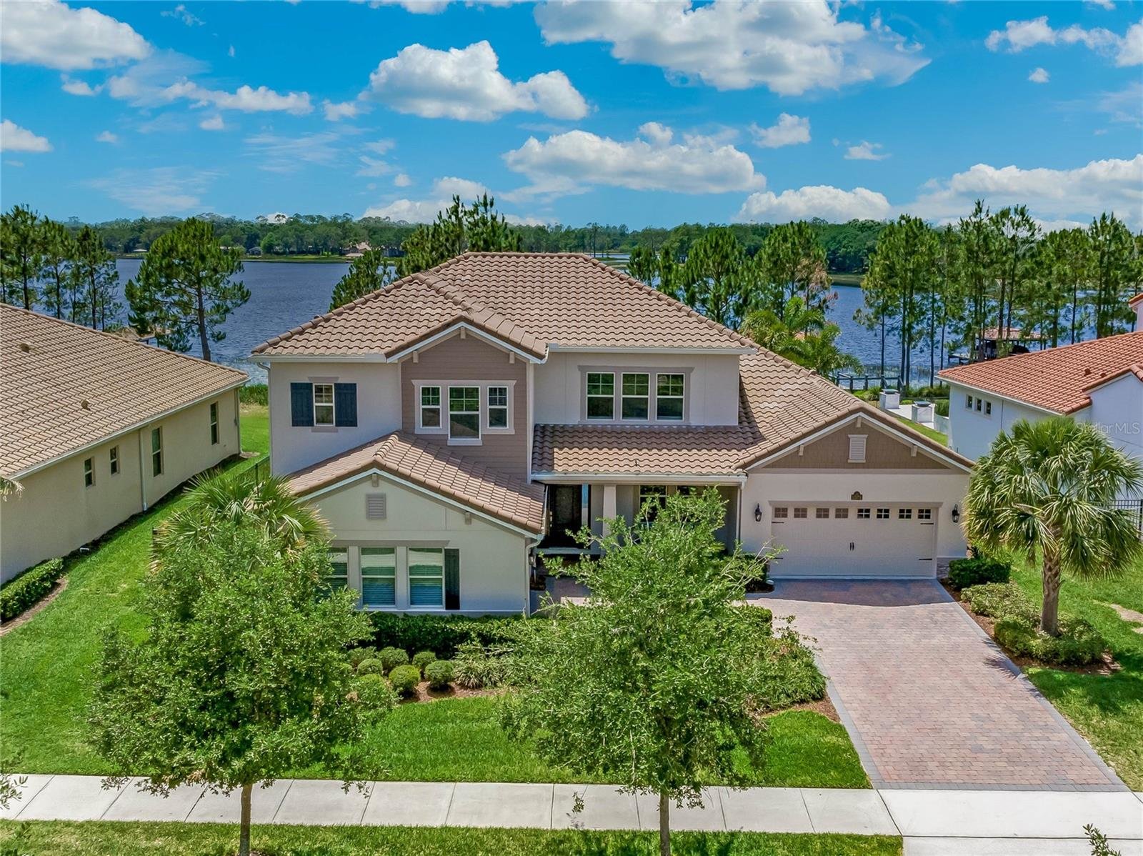 front of two story home on the water